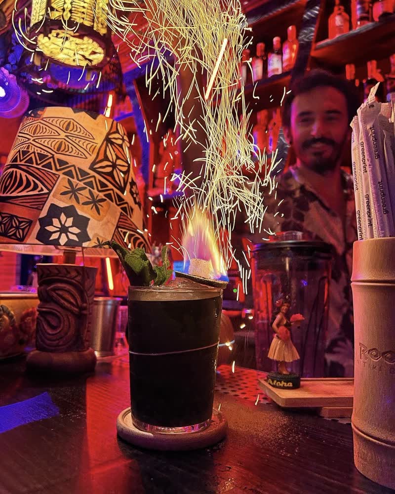 Flaming tiki cocktail with sparks at Kaona Room speakeasy bar