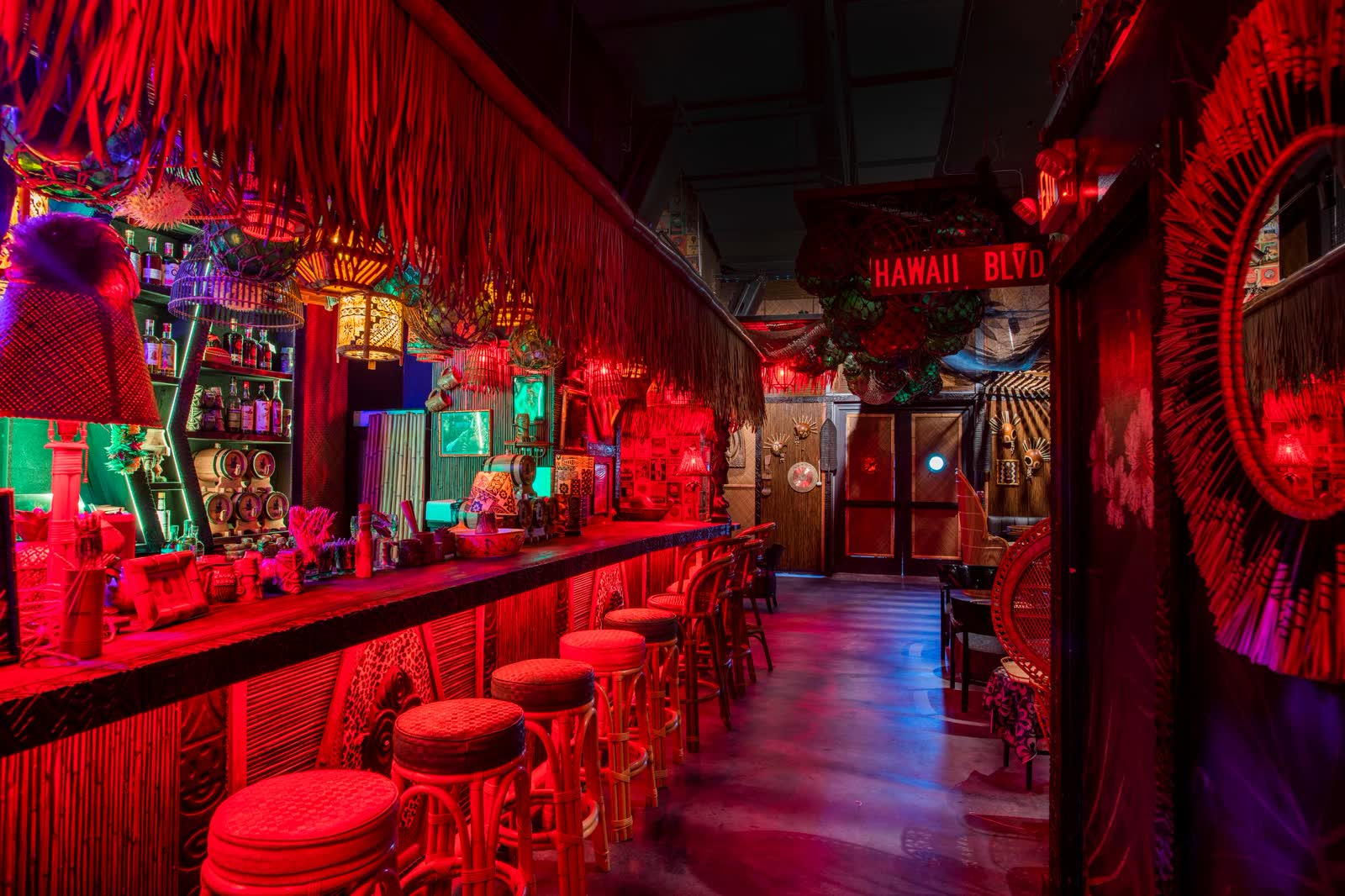 Kaona Room tiki speakeasy interior with bamboo bar and red ambient lighting in Miami Edgewater